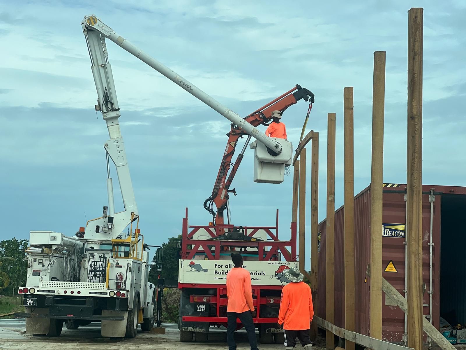 Crane lifting steel framing on a build